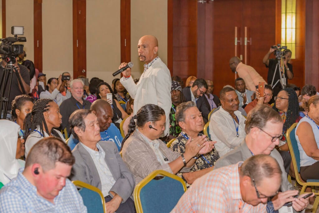 A speaker in conversation with the audience at a previous CanEx conference.